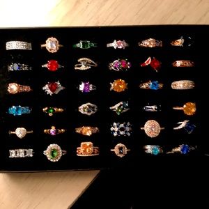 Varies gold and silver rings all color gems